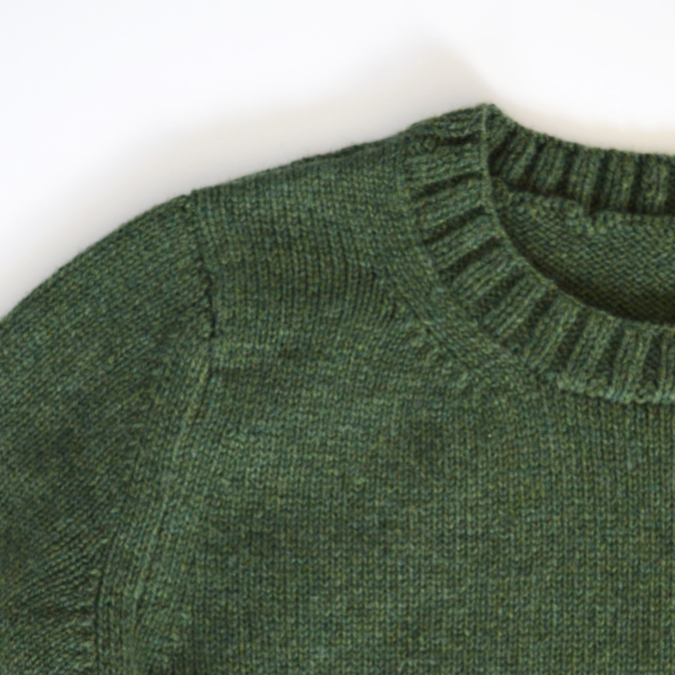 close up of rib neckline. knitting pattern, knitting kit, green jumper.