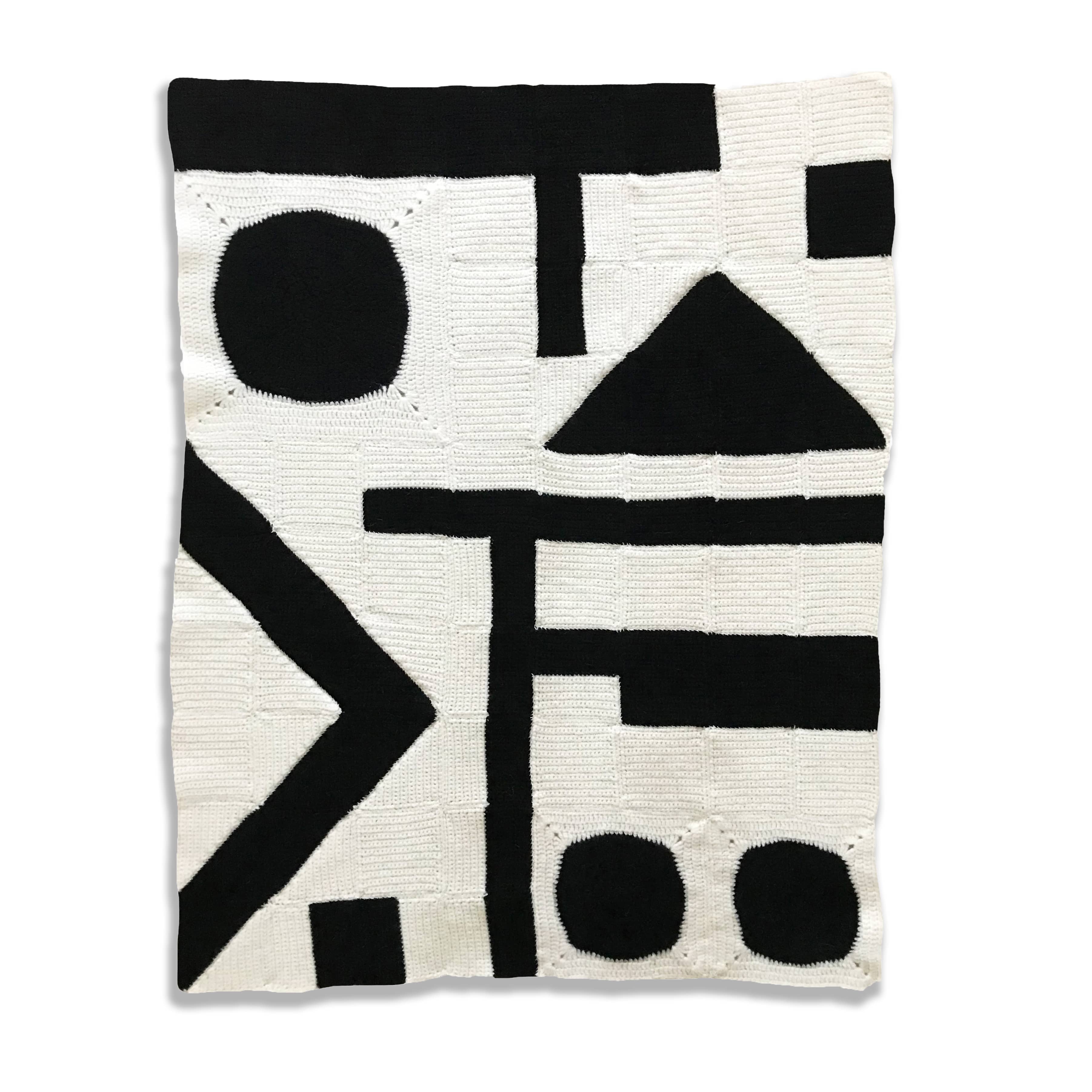 black and white modern art abstract crochet blanket kit laid out flat