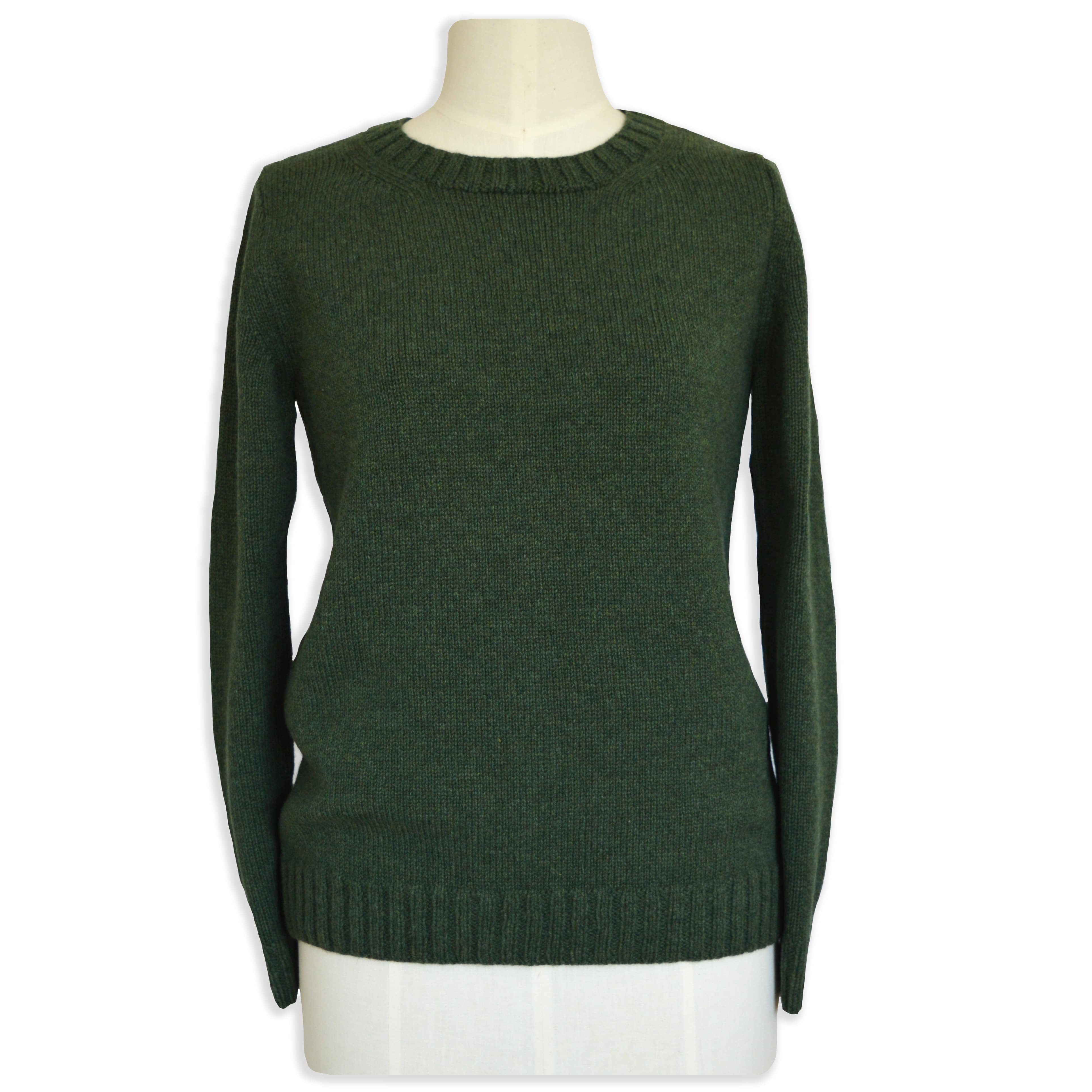green knitted jumper on stand showing jumper made from knitting pattern, knitting kit with yarn included