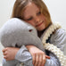 close up of girl cuddling large amigurumi crochet octopus