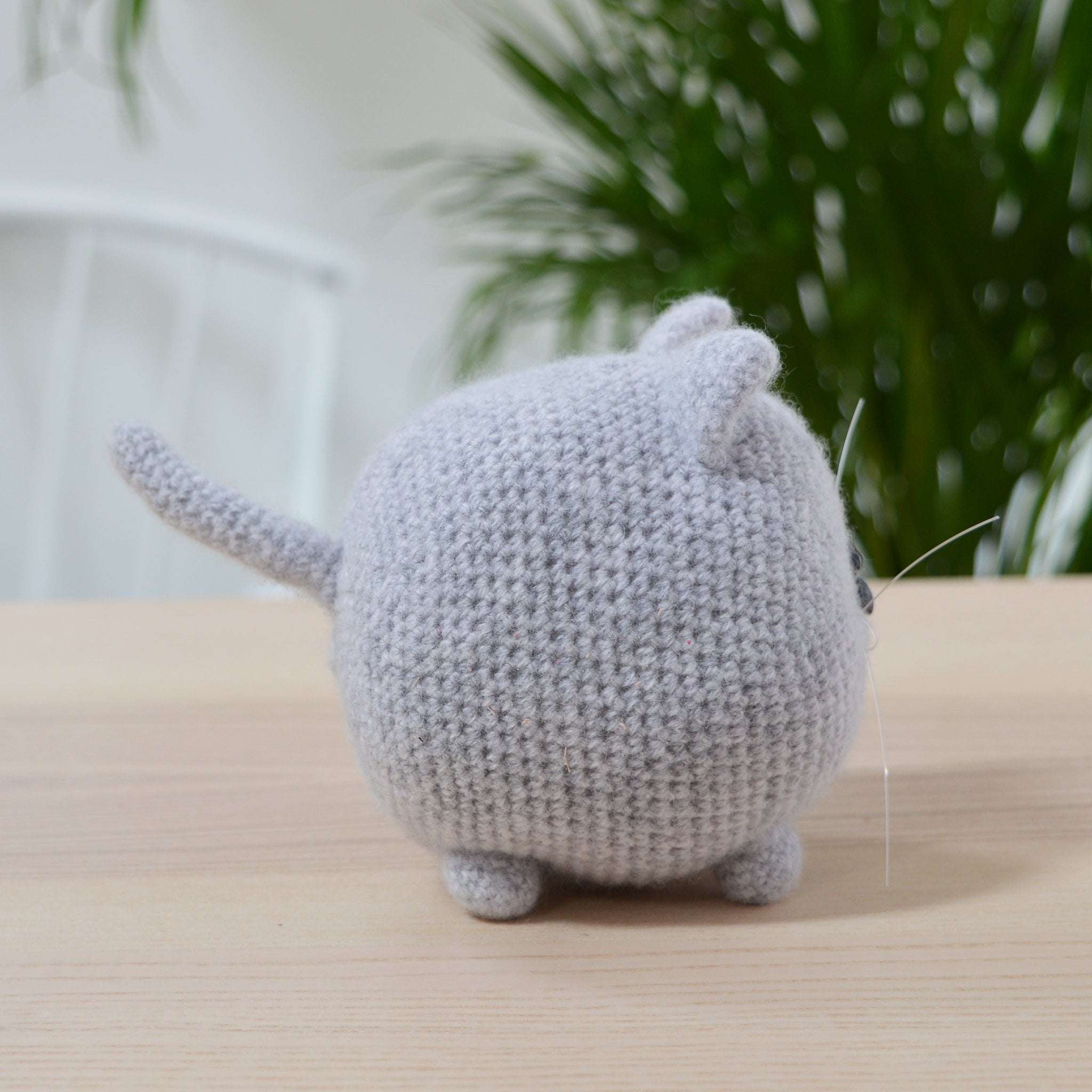 side view of completed amigurumi cat from cat crochet kit