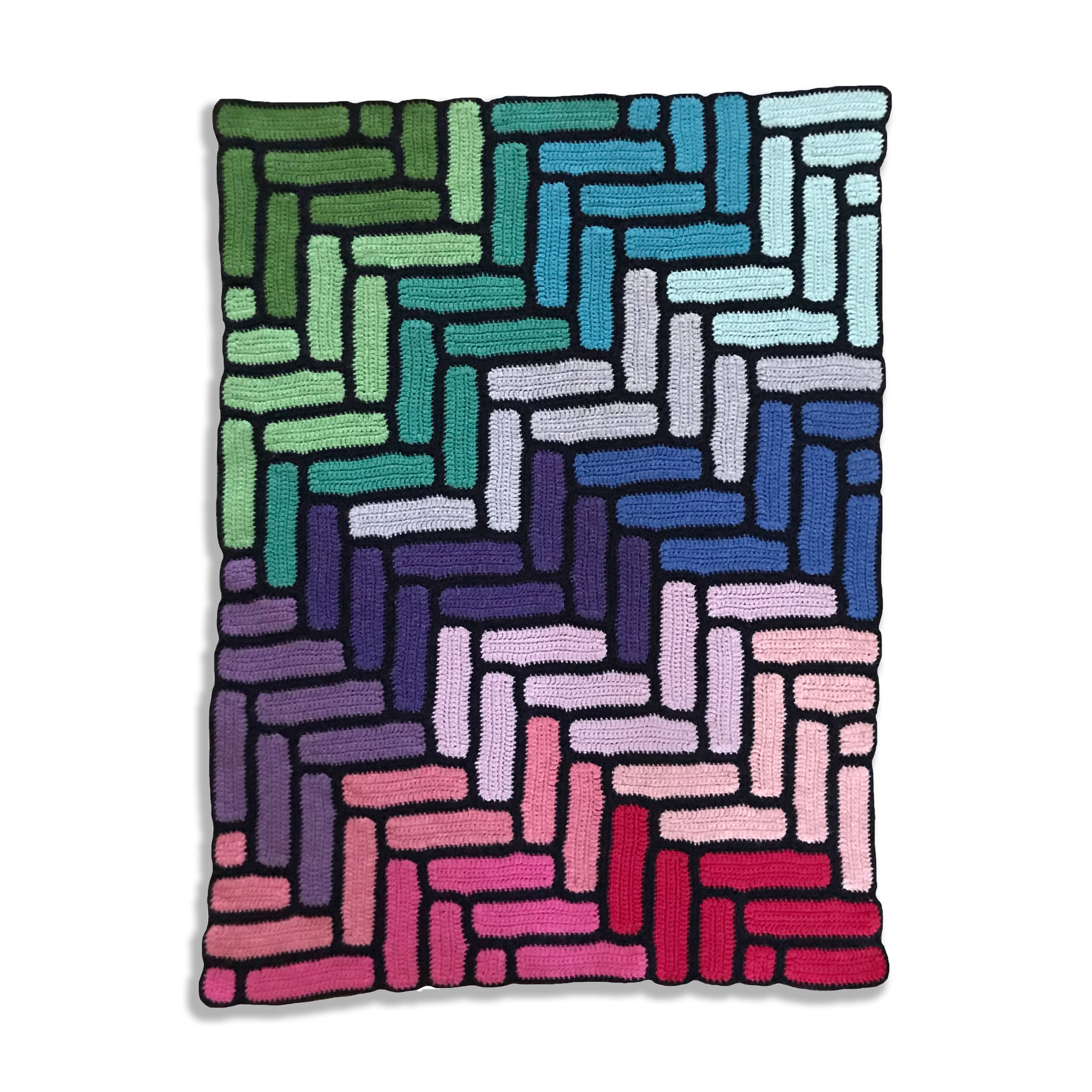 modern bright granny square blanket laid flat