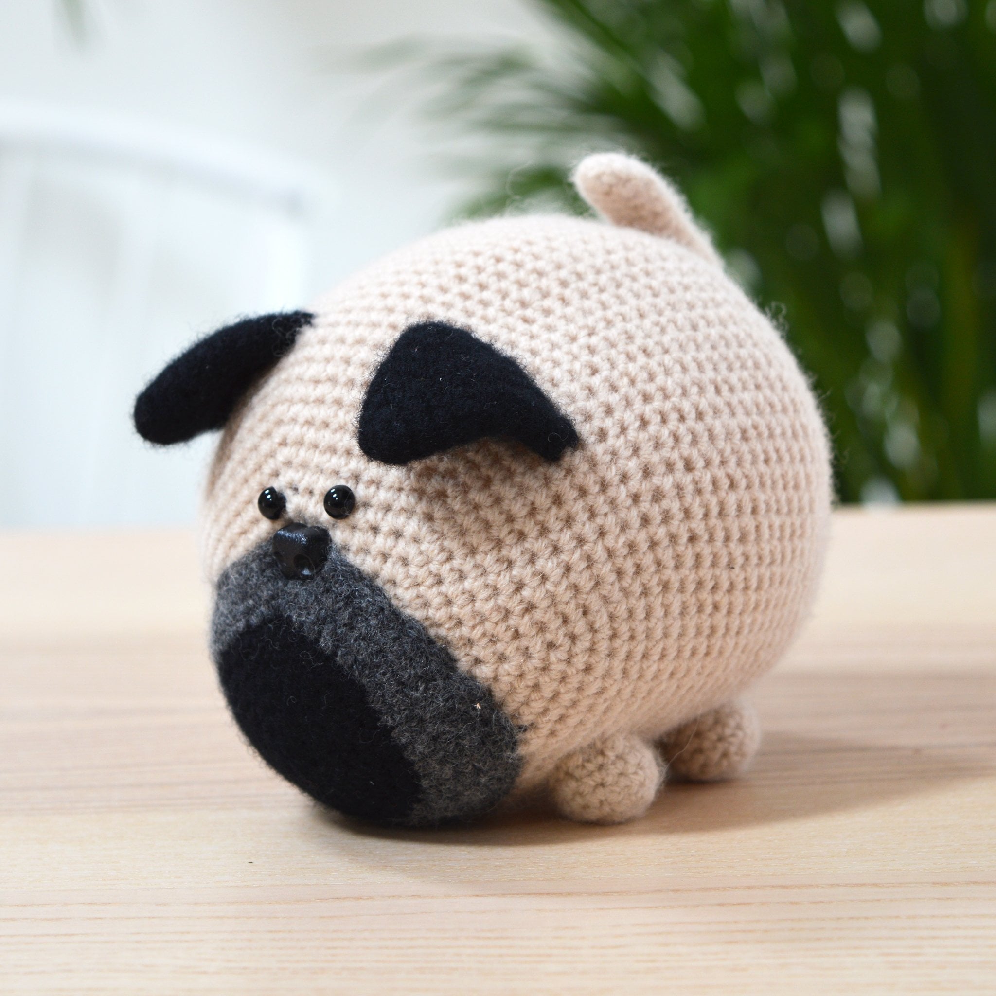 amigurumi pug on table