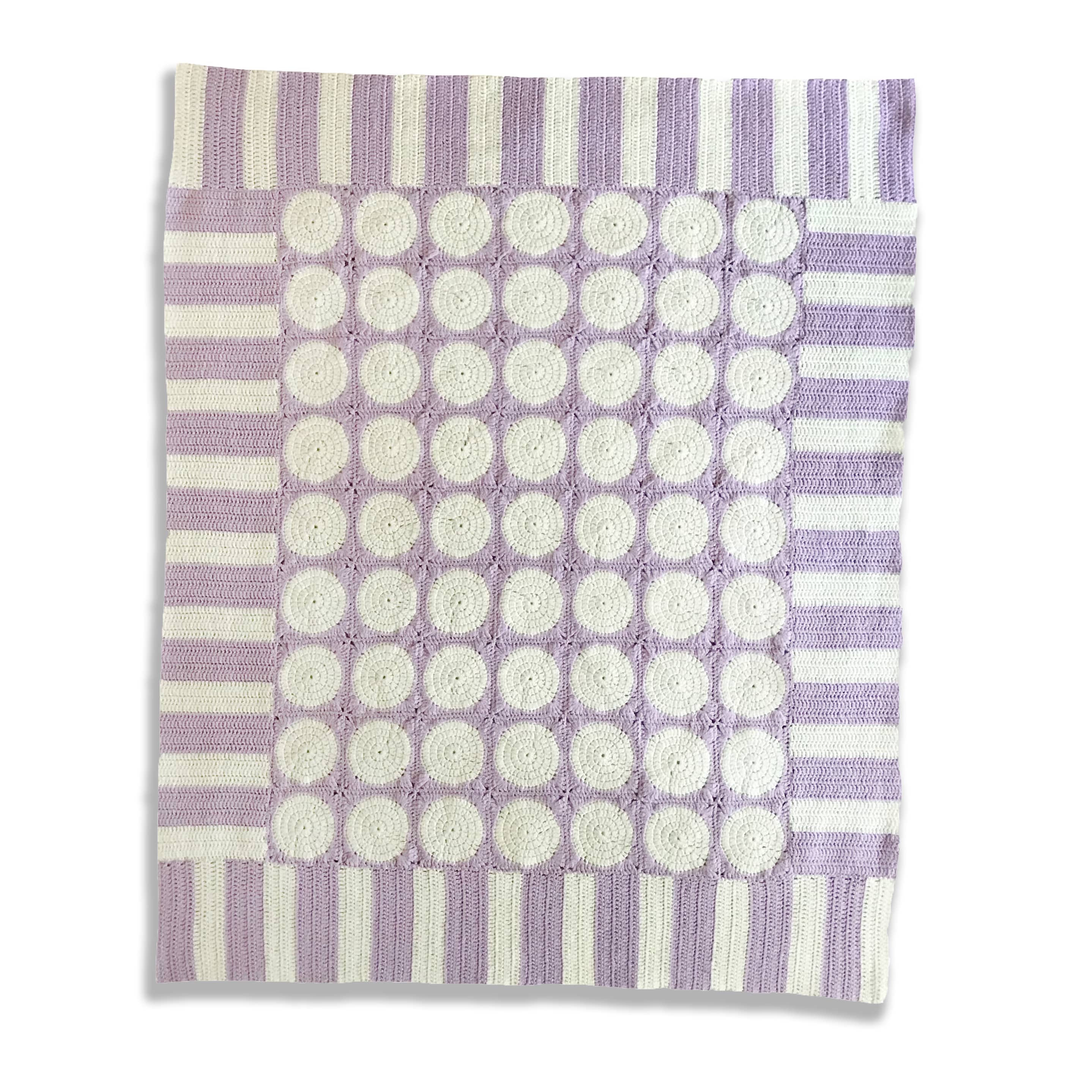 modern lilac and white granny square blanket laid flat