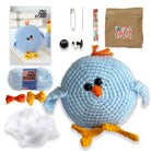 Crocheted blue bird toy with yarn, needles, and packaging on a white background