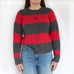 woman wearing knitting pattern cardigan with raglan sleeves and wide red and grey stripes