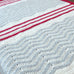 close up of zig zag and stripe blanket crochet kit