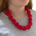 Woman wearing completed braided crochet necklace