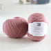 ball of pink yarn on table, pure wool, british yarn. lambswool