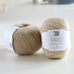 beige ball of wool on table, pure lambswool, british yarn